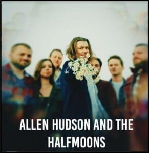 Band with Allen Hudson holding flowers and wearing a cape